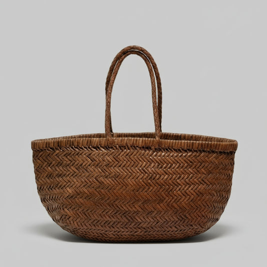 Woven basket with a decorative tag on a beige background