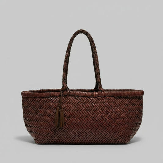 Woven brown handbag on a light background